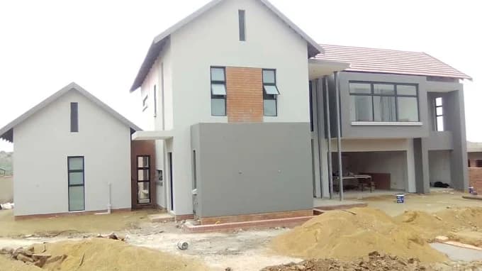 Modern double-storey home exterior built by Dawgthemba Construction